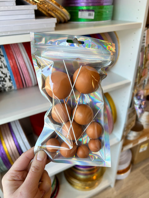 Orange Balls on Wires