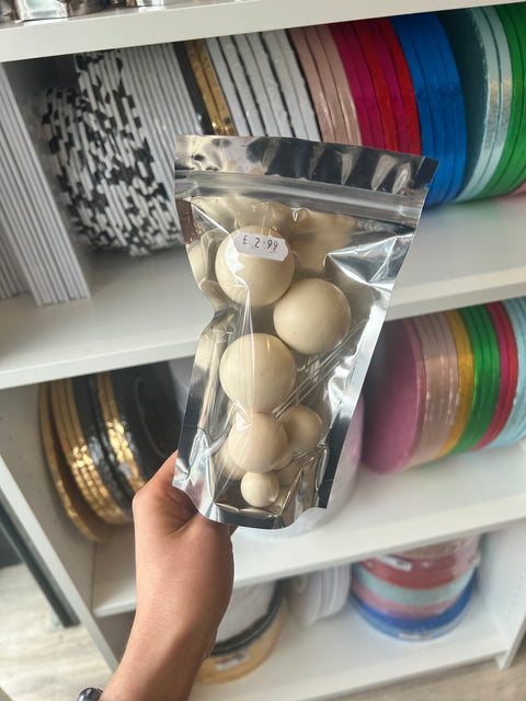 Beige Balls on Wires